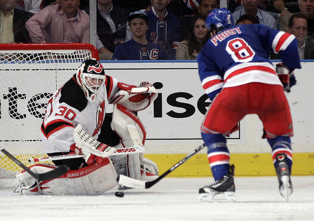 Martin Brodeur stops a shot on the goal  