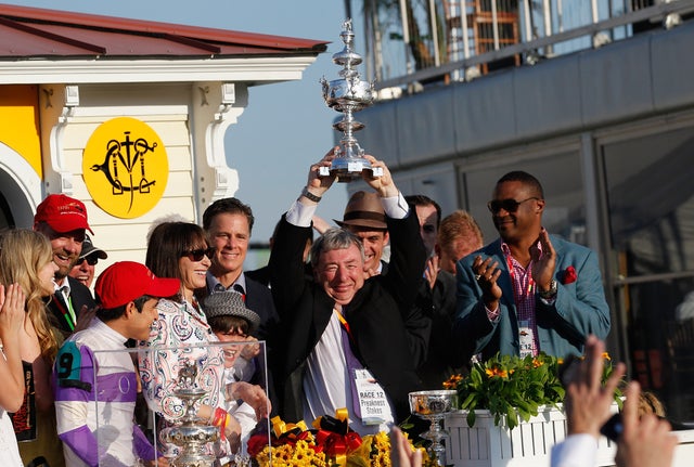 Owner J. Paul Reddam celebrates in the winners circle 