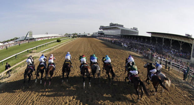 In this image taken with a fisheye lens, the field breaks from the starting gate for the 137th Preakness Stakes horse race 
