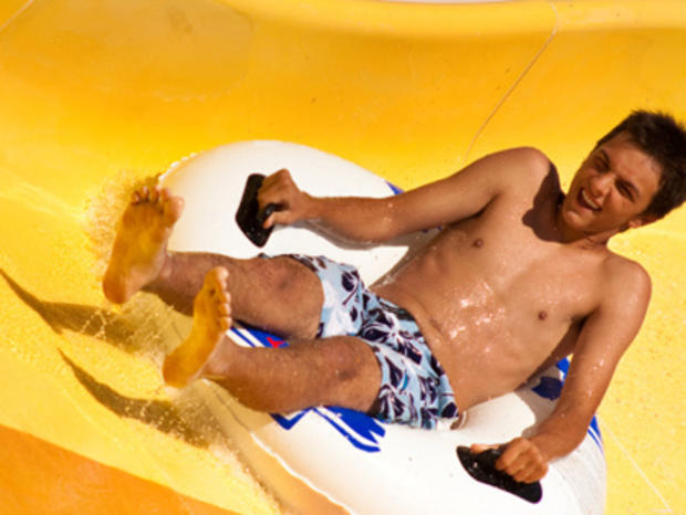Waterpark - teen on slide 