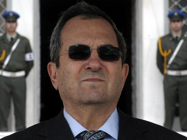 Israeli Defense Minister Ehud Barak reviews a military honor guard during a welcoming ceremony in Athens, Greece, Jan. 10, 2012. 