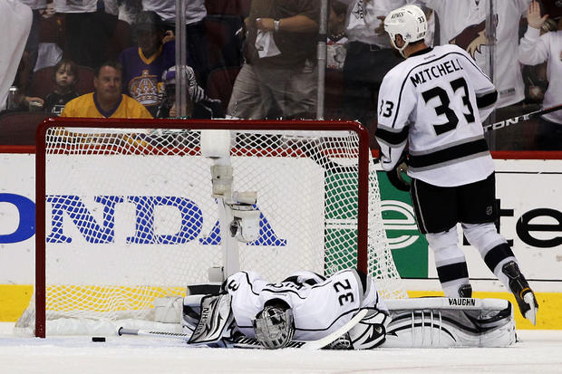 Jonathan Quick  lays on the ice after giving up a goal  
