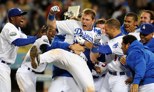 A.J. Ellis is mobbed at home plate by teammates after hitting a three run home run 