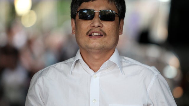 Chinese activist Chen Guangcheng speaks to the media upon arriving on the campus of New York University May 19, 2012, in New York City. 