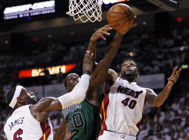Udonis Haslem (40) and LeBron James (6) pressure Boston Celtics' Brandon Bass 
