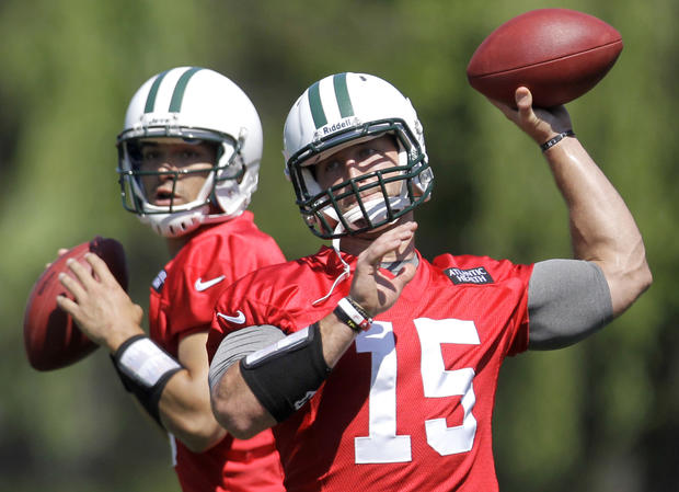Mark Sanchez and Tim Tebow workout during NFL practice 