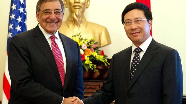 Secretary of Defense Leon Panetta shakes hands with Vietnamese Foreign Minister Pham Binh Minh 