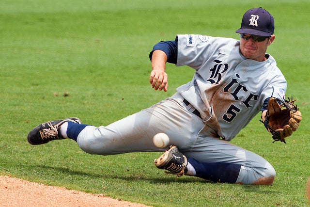Christian Stringer cannot make the play on an RBI single 