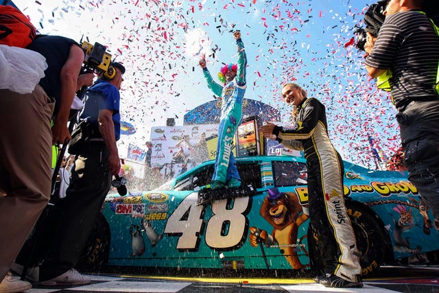 Jimmie Johnson celebrates in victory lane  
