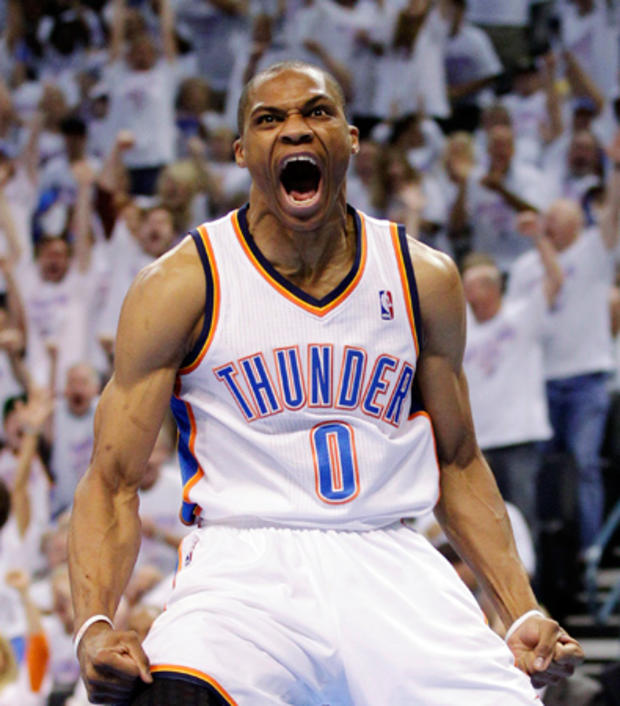 Russell Westbrook reacts after dunking the ball 