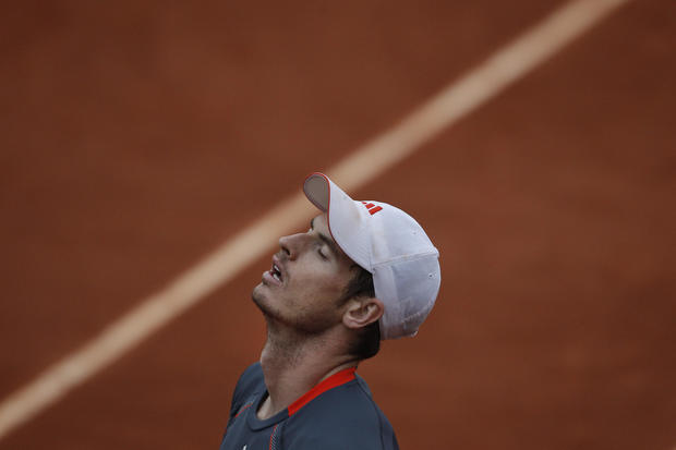 Andy Murray of Britain closes his eyes after missing a return 