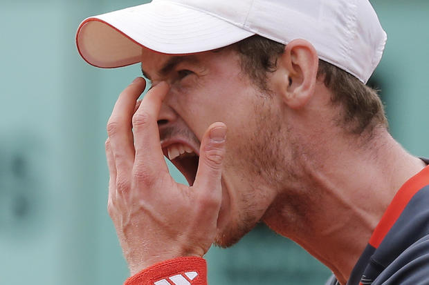 Andy Murray of Britain screams after missing a return 