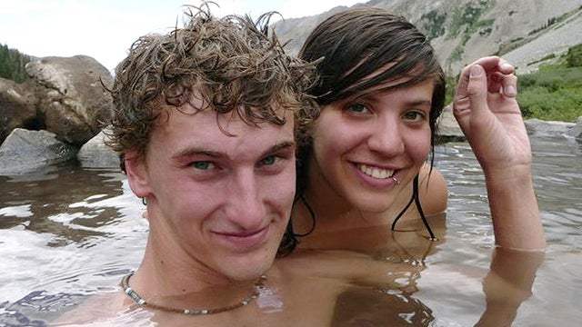 Alec Brown and his girlfriend Erica Klintworth pose in a rock pool at an unknown location 