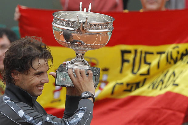 Rafael Nadal of Spain holds the trophy  