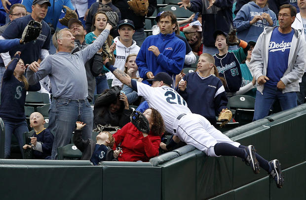 Mike Carp is left empty-handed after diving into the stands 