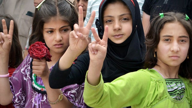 Syrian girls flash victory signs during a demonstration in Kfarnebel, Syria, May 29, 2012, in this citizen journalism image taken by Edlib News Network. 