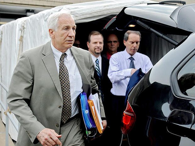 Former Penn State University assistant football coach Jerry Sandusky walks out of Centre County Courthouse after the first day of trial, in Bellefonte, Pa., Monday, June 11, 2012. 
