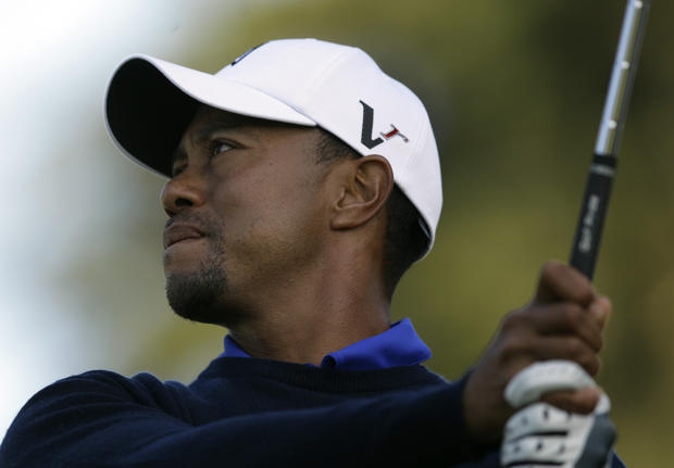 Tiger Woods hits a drive on the seventh hole during a practice round 