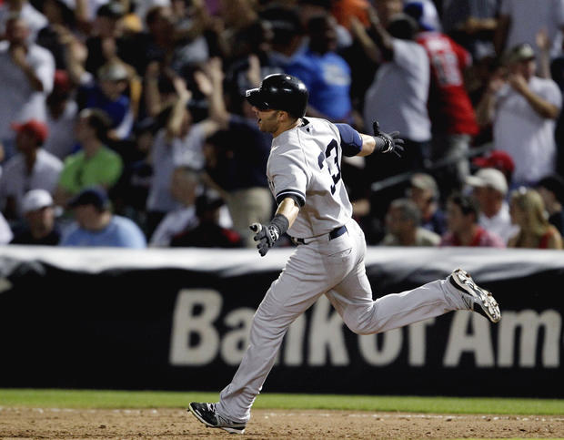 Nick Swisher rounds the bases after hitting a two-run home run  