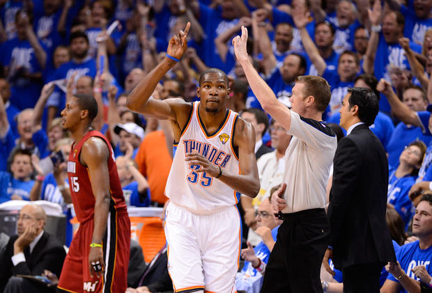 Kevin Durant reacts after making a shot 