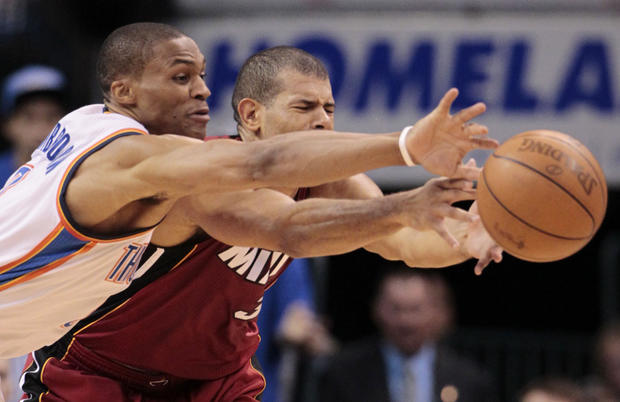 Oklahoma City Thunder point guard Russell Westbrook and Miami Heat small forward Shane Battier go after a loose ball  