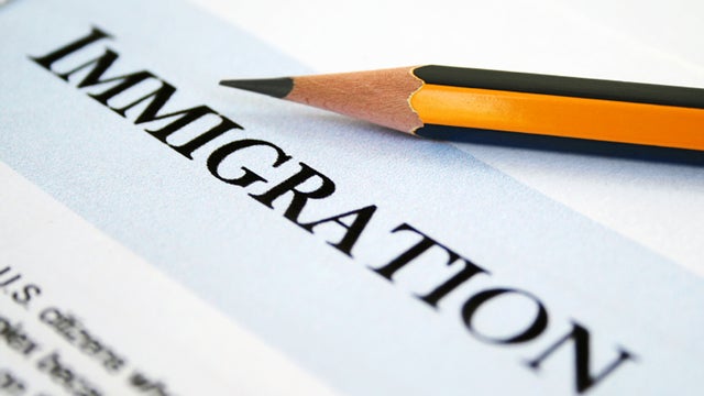 Close up of pencil on immigration application form.  