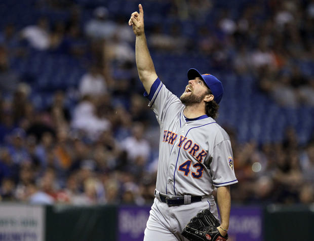 R.A. Dickey points to the ball  
