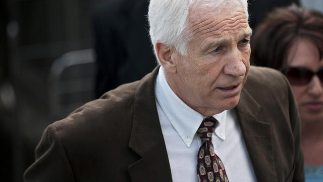 Former Penn State assistant football coach Jerry Sandusky leaves the Centre County Courthouse after the fourth day of his child sex abuse trial June 14, 2012, in Bellefonte, Pa. 