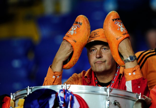 A Dutch fan sits dejected 