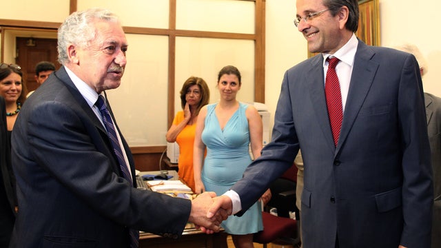 ew Democracy conservative party Antonis Samaras, right, greets Democratic Left party leader Fotis Kouvelis 