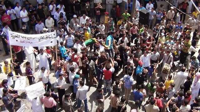 Syrians chant slogans during a demonstration 