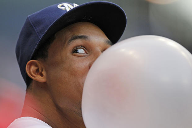 Carlos Gomez blows a bubble  