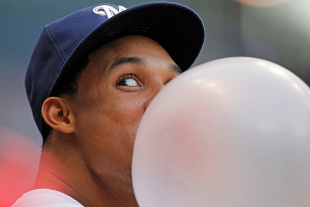 Carlos Gomez blows a bubble  
