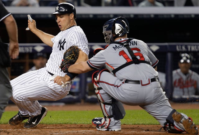 Brian McCann tags out Mark Teixeira 