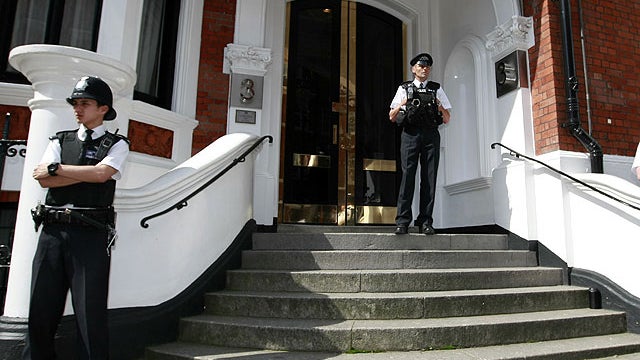 Police stand guard outside the Ecuadorian Embassy, London, Wednesday June 20, 2012.  