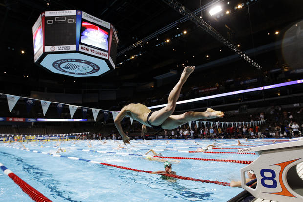swimmer dives during practice at the U.S. Olympic swimming trials 