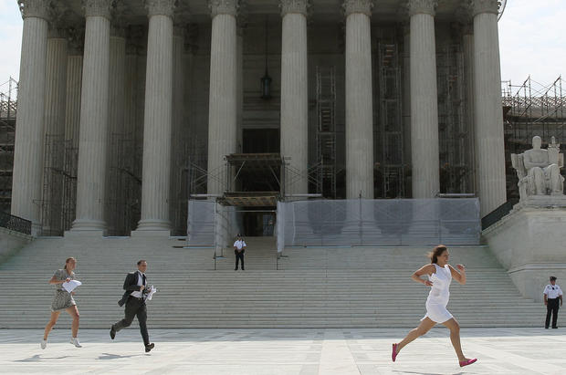 Reporters run with the U.S. Supreme Court's health care decision  