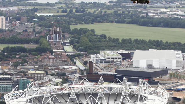 Royal Air Force Puma helicopter is pictured flying over the 2012 Olympic Stadium during an Aug. 18, 2011,  training flight over London .  