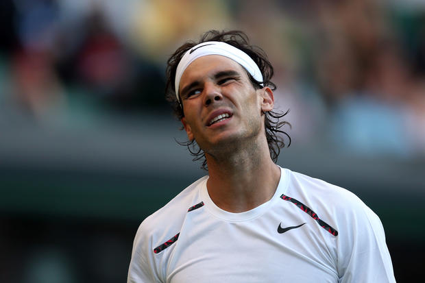 Rafael Nadal reacts in his match against Lukas Rosol  
