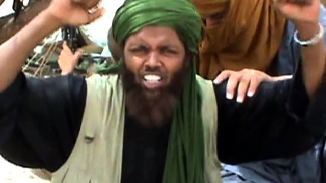 A still from a video shows an Islamist militant celebrating and shouting "Allahu akbar" (God is great) after destroying an ancient shrine in Timbuktu, Mali, July 1, 2012. 