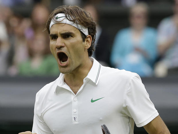 Roger Federer of Switzerland reacts after winning a set  