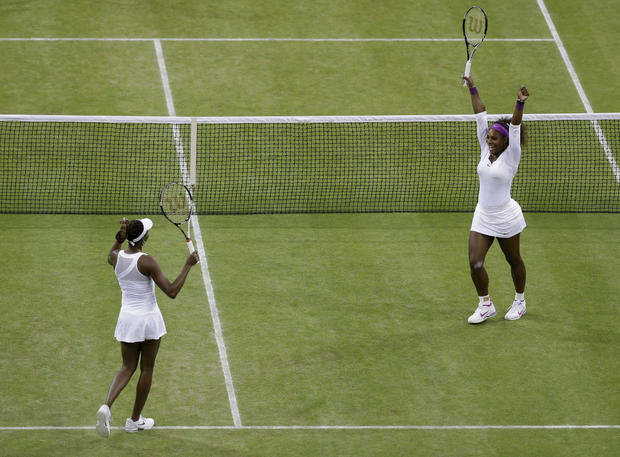 Venus Williams and Serena Williams react after defeating Andrea Hlavackova and Lucie Hradecka 