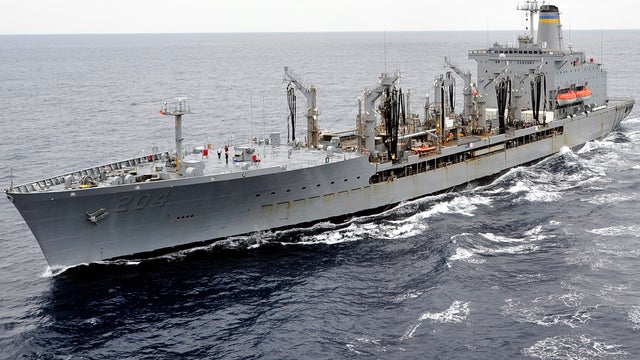 The replenishment oiler USNS Rappahannock sails alongside the aircraft carrier USS George Washington in the Pacific Ocean Oct. 4, 2011. 