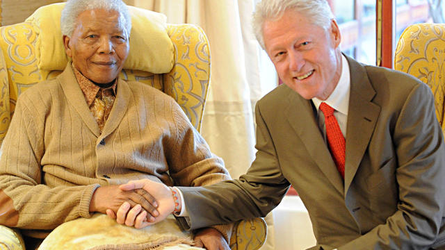 Former US President, Bill Clinton, right, meets with former South African President Nelson Mandela at his home in Qunu, South Africa, Tuesday, July 17, 2012 on the eve of Mandela's 94th birthday. 
