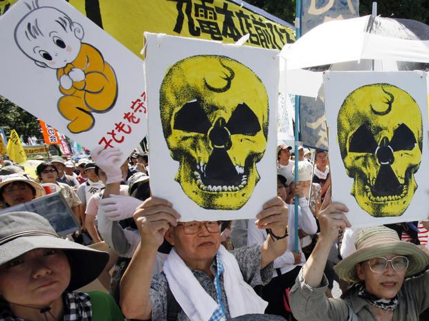 Protesters carry anti-nuclear placards during a march in Tokyo 