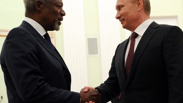 Syria peace mediator Kofi Annan, left, shakes hands with Russian President Vladimir Putin during their meeting in central Moscow July 17, 2012. 