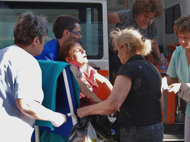An unidentified injured Israeli tourist is carried in front of Borgas hospital after an explosion at Burgas airport, outside the Black Sea city of Burgas, Bulgaria. 
