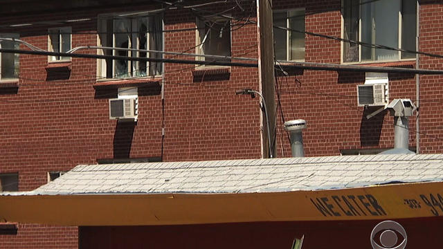 Police enter alleged gunman's booby-trapped apartment  