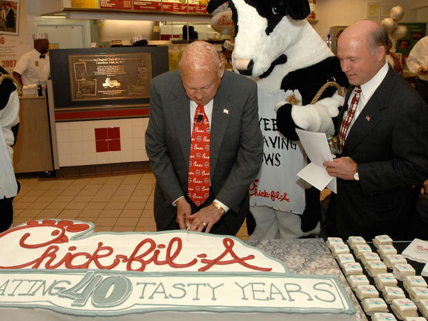 Chick-fil-A founder Truett Cathy (cutting cake), and his son, President and COO Dan Cathy 