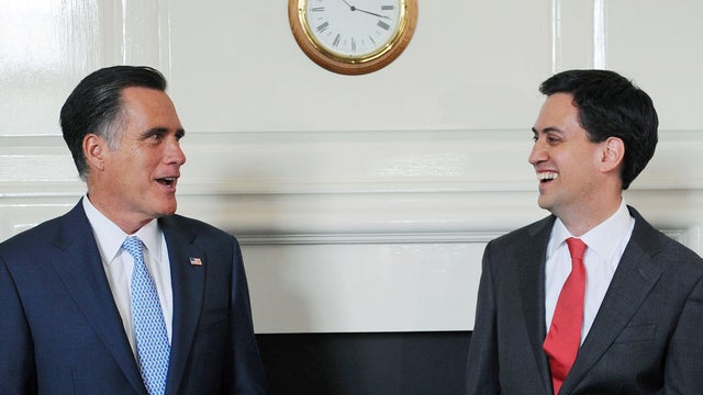 Britain's Labour leader Ed Miliband greets Republican presidential candidate Mitt Romney 